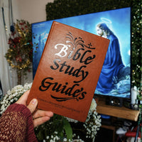 Brown Bible study guide cover held in hand
